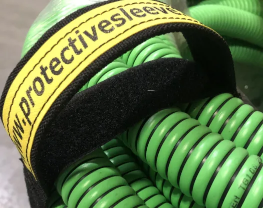 Handy Handle wrapped around a coil of green hose