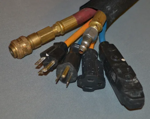 Sleeve bundling air lines and power cords