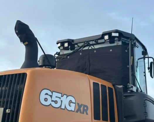 Windshield cover on a loader, seen from the rear