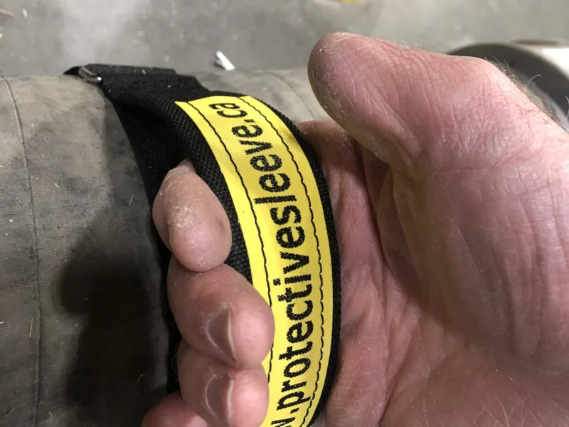 Lifting a large hose by its Handy Handle