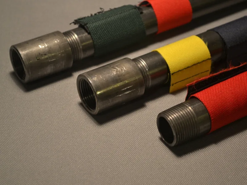 Close-up of colour markers on steel pipe
