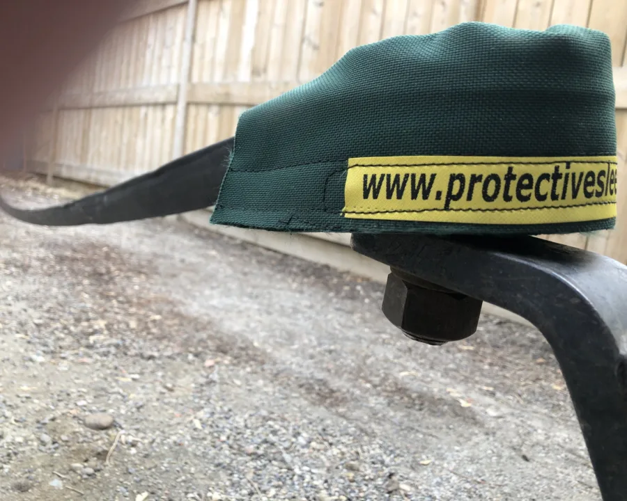 Strap saver protecting a tow strap at the hitch