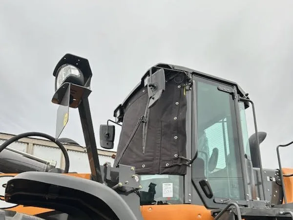 Windshield cover on a wheel loader cab